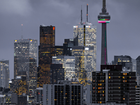 An dark image of Toronto highlighting the mistakes to avoid when selling a condo in Toronto by Toronto real estate agent Marco Pedri.
