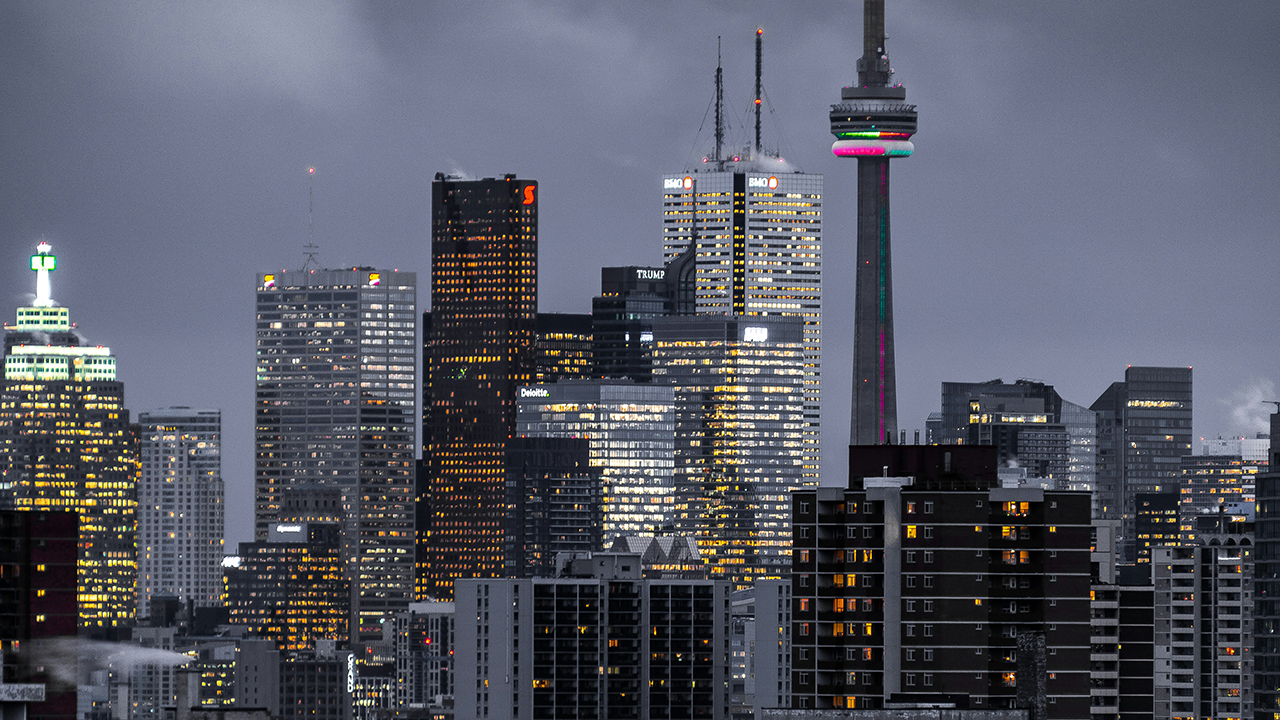 An dark image of Toronto highlighting the mistakes to avoid when selling a condo in Toronto by Toronto real estate agent Marco Pedri.