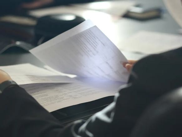 An image of a lawyer reviewing Toronto condo status certificate documents.