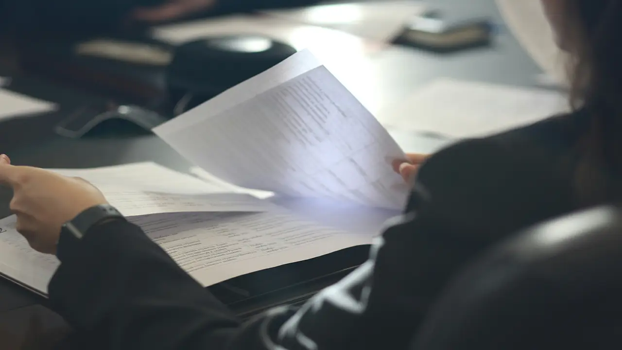 An image of a lawyer reviewing Toronto condo status certificate documents.